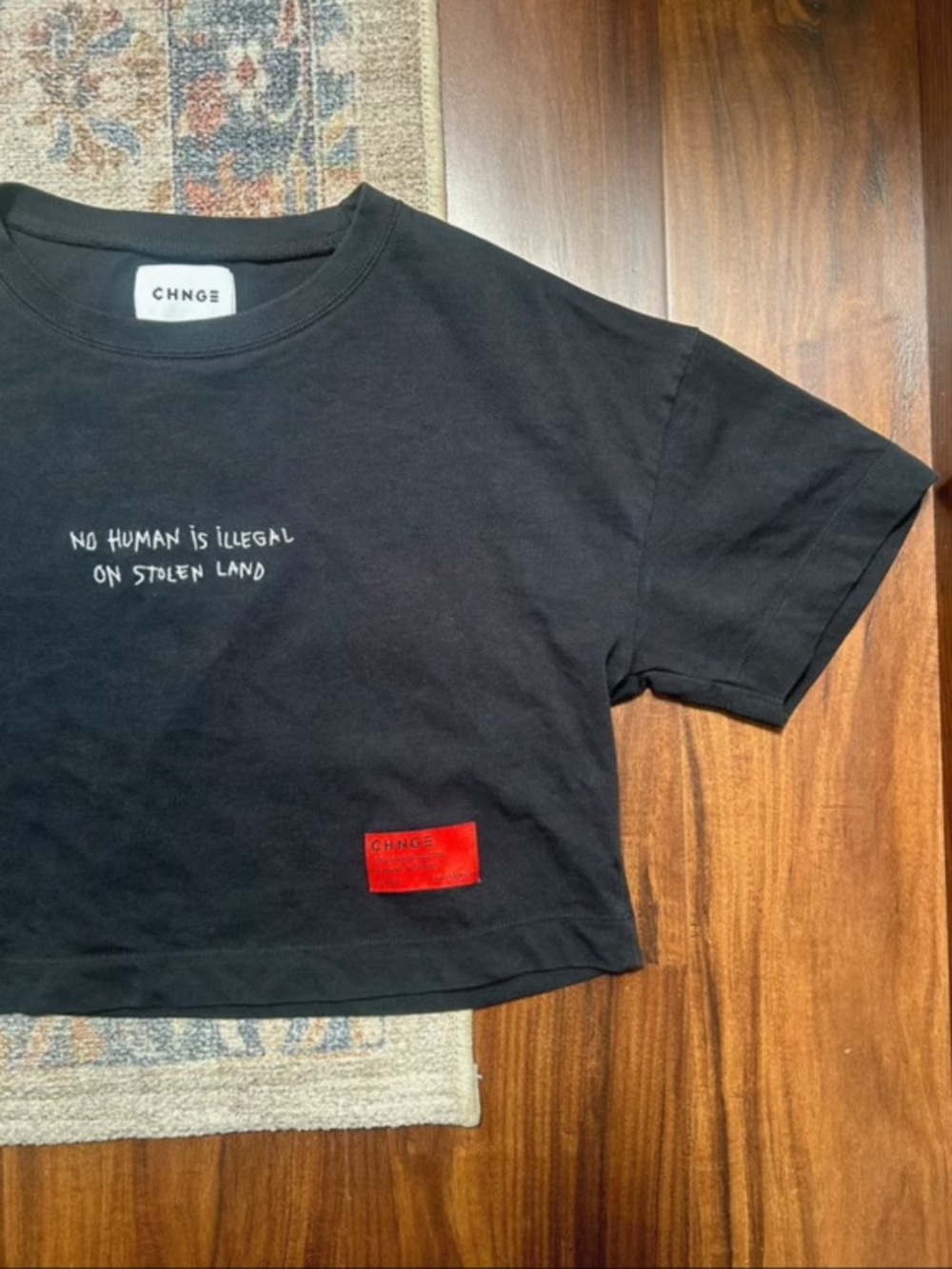 CHNGE Black Cropped Tee with White Script and Red Patch